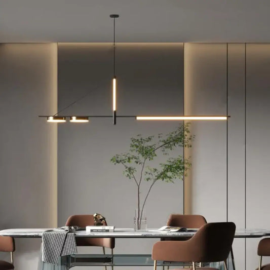 Minimalist black LED linear pendant light over a dining table in a modern kitchen