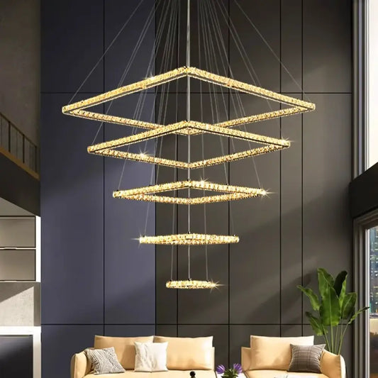 Chrome multi-ring LED crystal chandelier hanging in a modern dining room