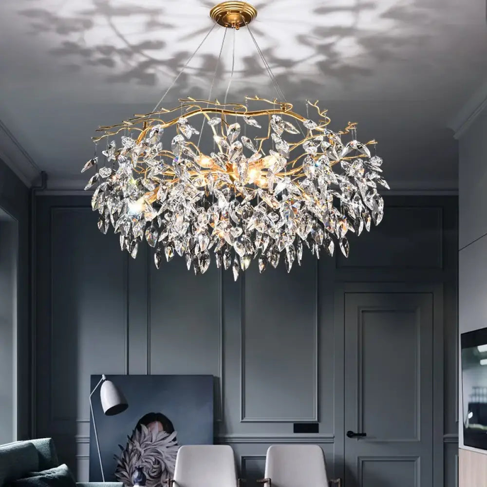 Modern LED chandelier with leaf-shaped crystal accents in a dining room