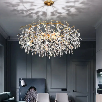 Modern LED chandelier with leaf-shaped crystal accents in a dining room