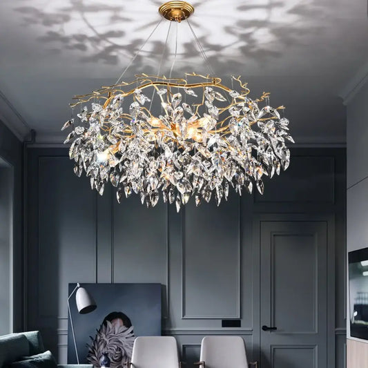 Modern LED chandelier with leaf-shaped crystal accents in a dining room