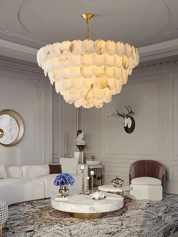 Oval gold and natural marble LED chandelier above a kitchen island