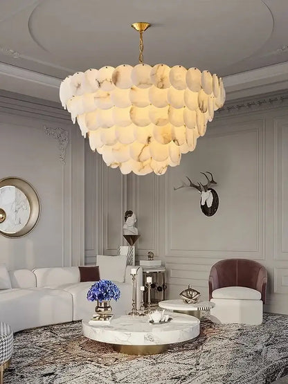 Oval gold and natural marble LED chandelier above a kitchen island