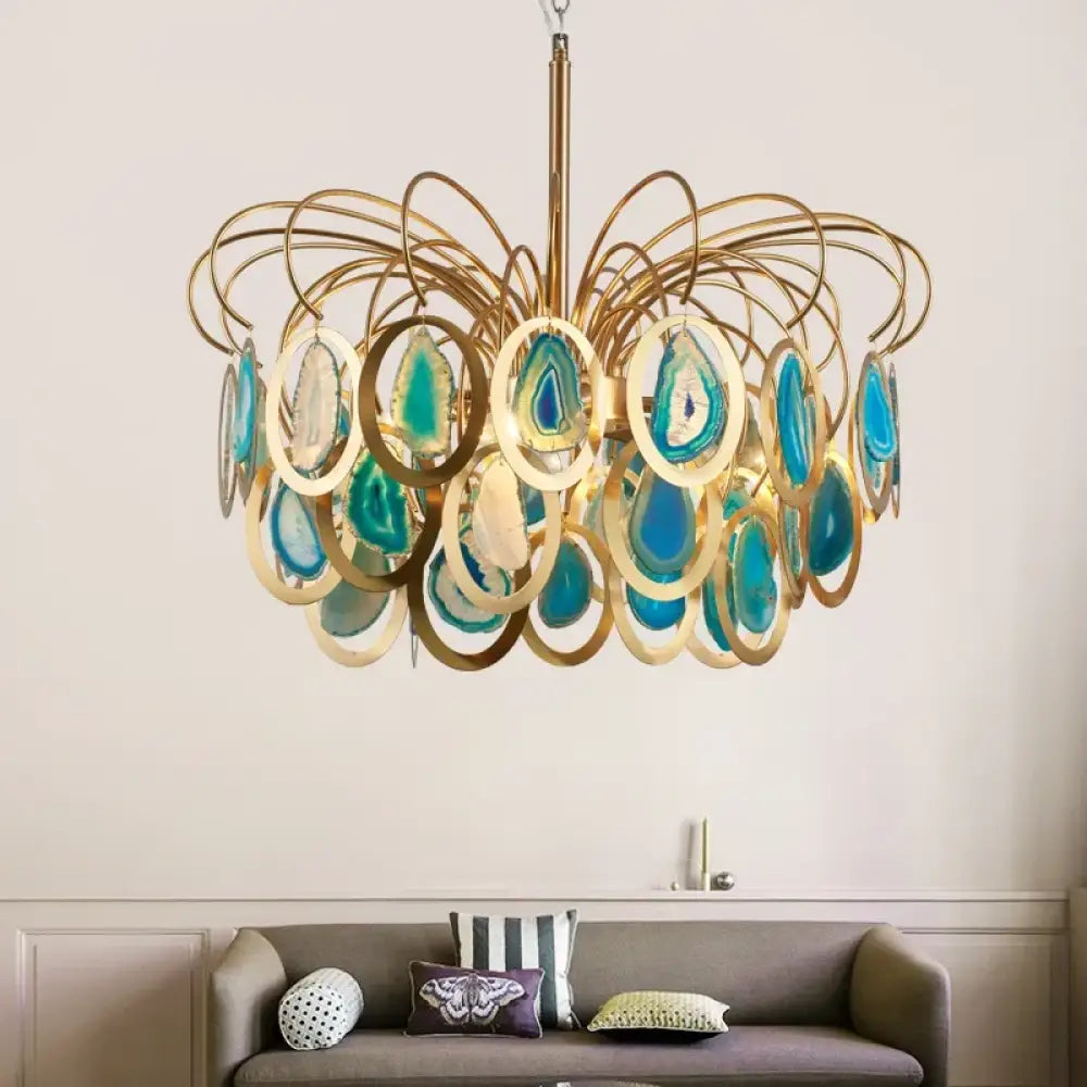Modern crown agate LED chandelier with stone accents hanging over a dining table