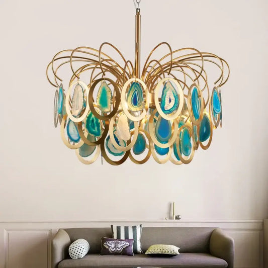 Modern crown agate LED chandelier with stone accents hanging over a dining table