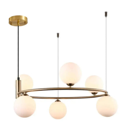 Gold Nordic ceiling chandelier with glass shades in a modern bedroom