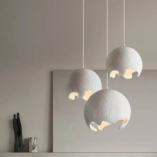 Gray Wabi-Sabi Nordic LED pendant light with an organic irregular shade above a dining table
