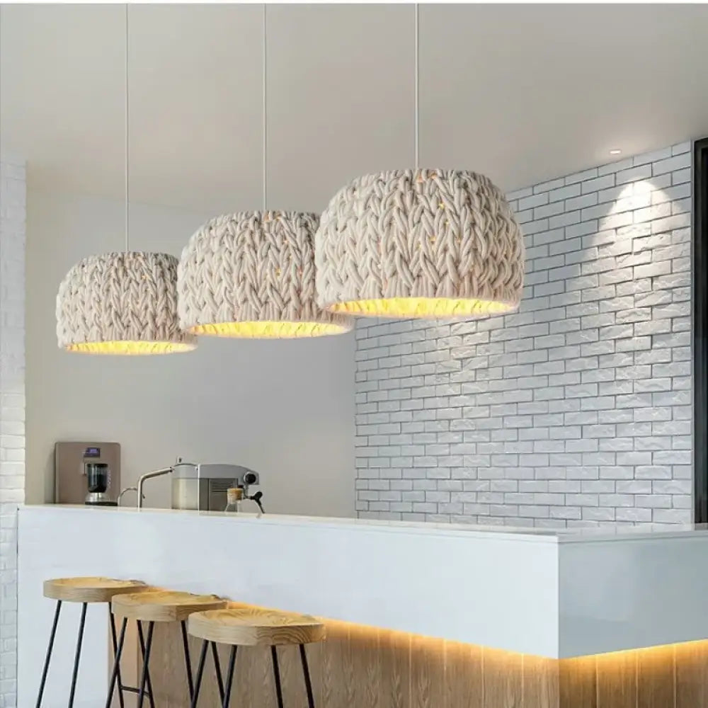 Nordic knitted rope LED pendant light with a textured shade hanging above a dining table