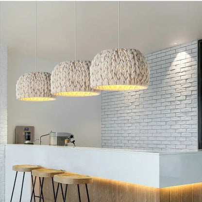 Nordic knitted rope LED pendant light with a textured shade hanging above a dining table