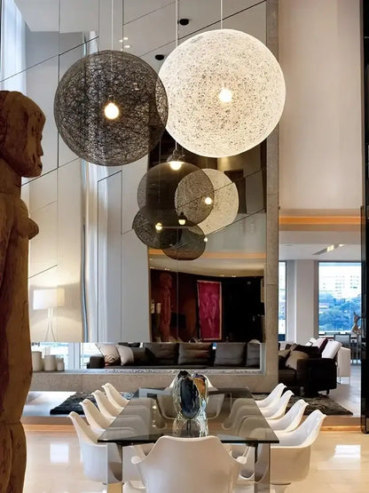 Beige rattan-weave spherical LED pendant light in a Nordic living room