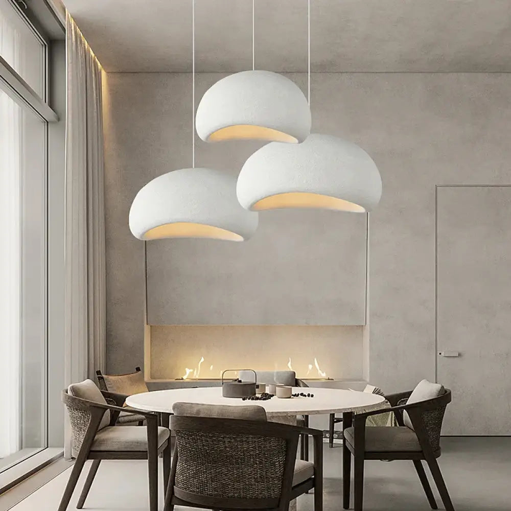 White Meera Nordic 3-light Wabi-Sabi LED pendant hanging above a minimalist dining table