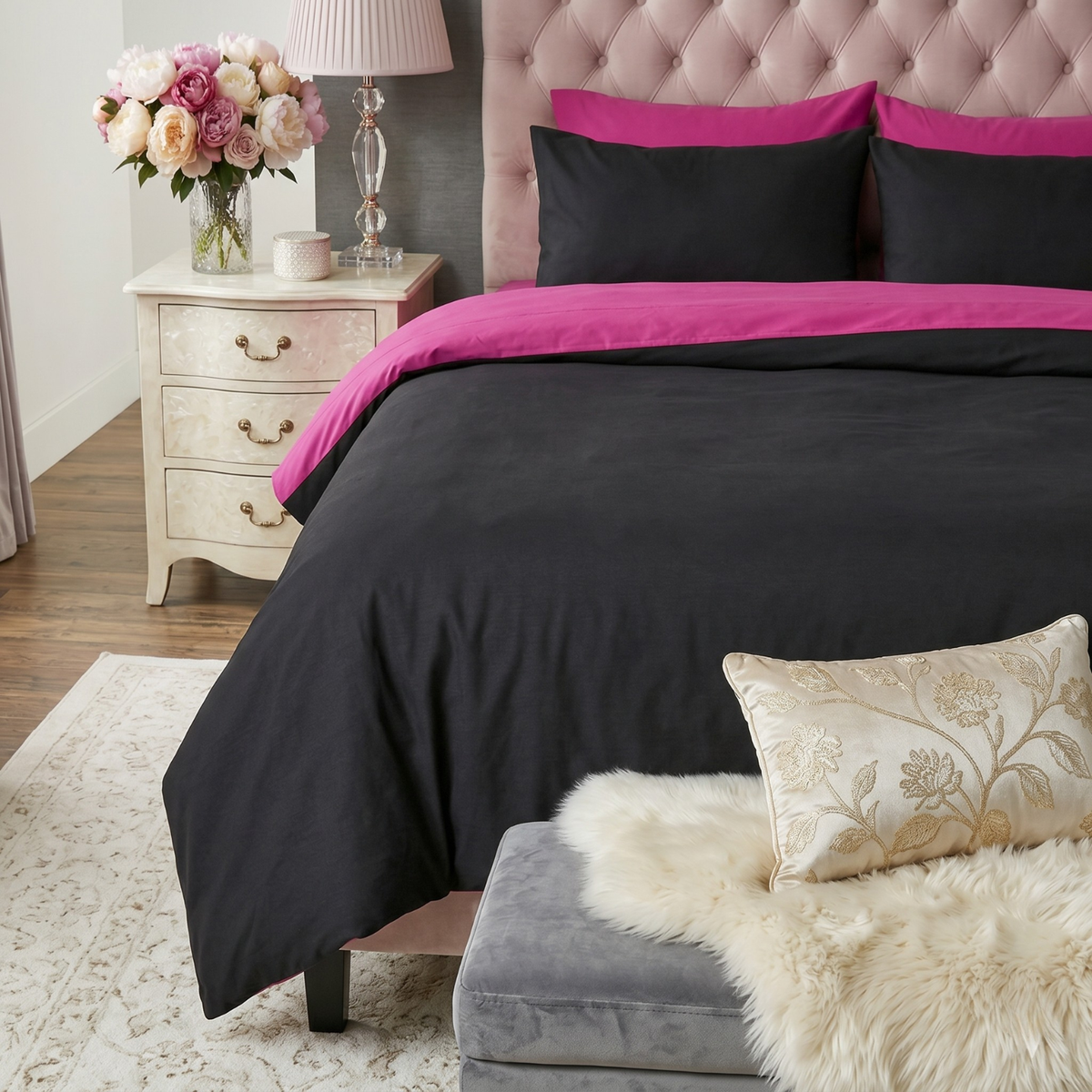 Hot pink and black reversible cotton comforter set with pillowcases on a bed in a teen bedroom