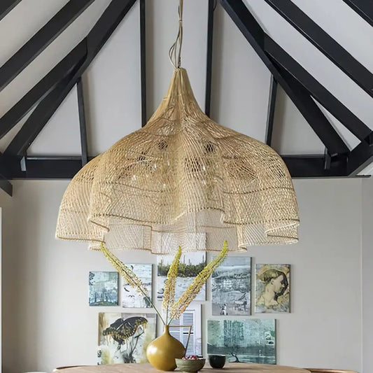 Natural handmade petal-shaped rattan pendant light hanging over a kitchen island