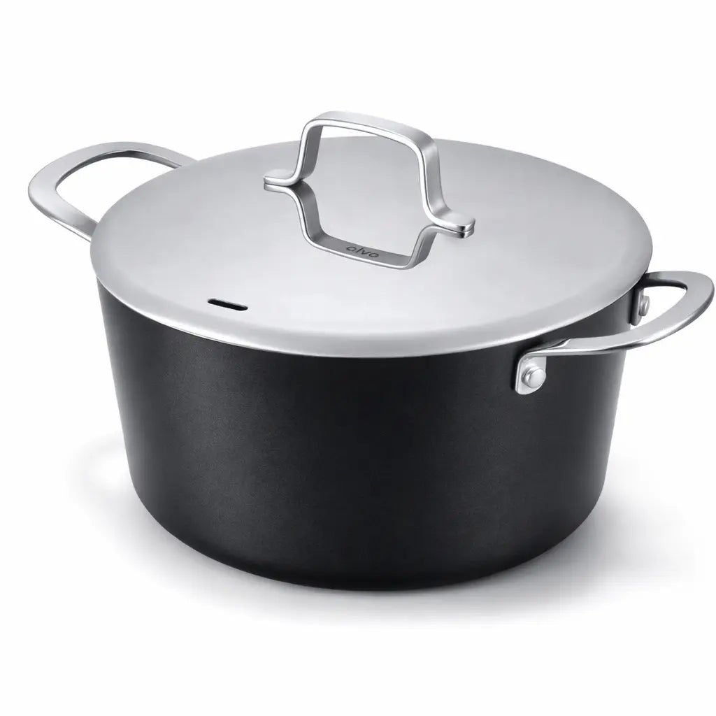4.5-quart ceramic nonstick stock pot with stainless steel lid and handles on a kitchen stove