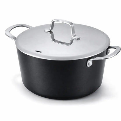 4.5-quart ceramic nonstick stock pot with stainless steel lid and handles on a kitchen stove