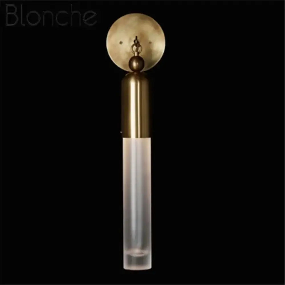 Gold bronze Nordic modern wall sconce with three heads in a contemporary dining room