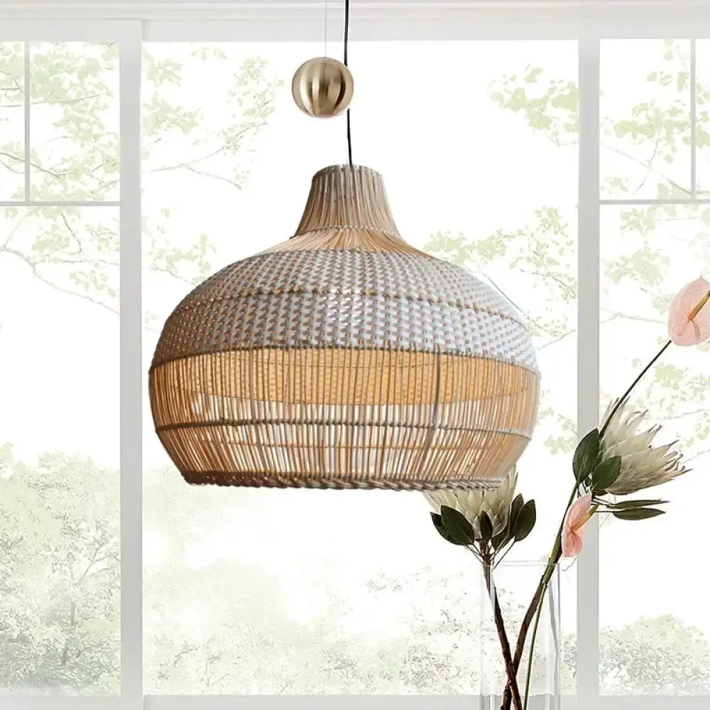 Handmade gyro-shaped Nordic rattan pendant light hanging above a kitchen island
