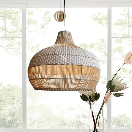 Handmade gyro-shaped Nordic rattan pendant light hanging above a kitchen island