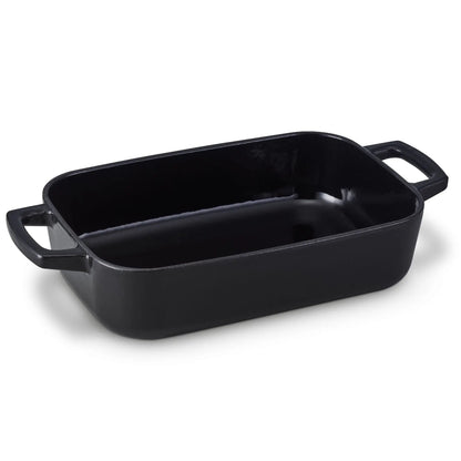Rectangular 12 x 8 inch enameled cast iron roasting pan with roasted vegetables on a kitchen table