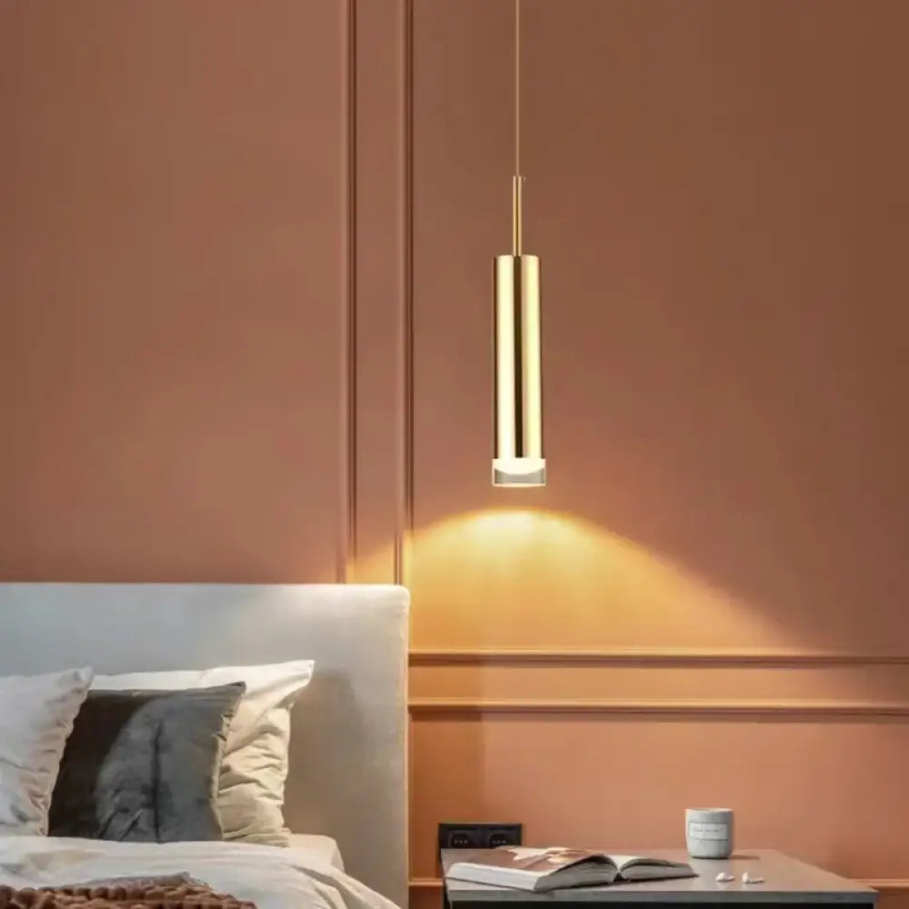 Olivia adjustable LED pendant light with a slim modern profile above a dining table