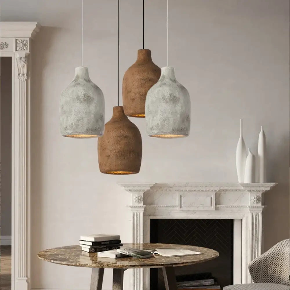 Nordic Wabi-Sabi Signature LED pendant light with an organic shade above a dining table
