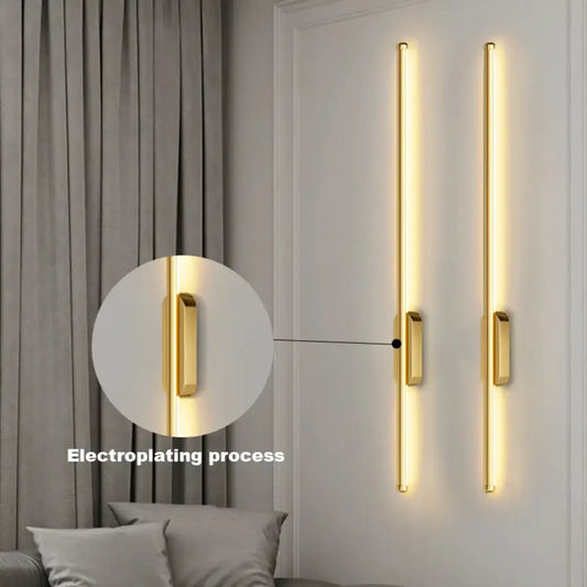 Black sleek LED Nordic linear wall sconce providing soft background light above a bed