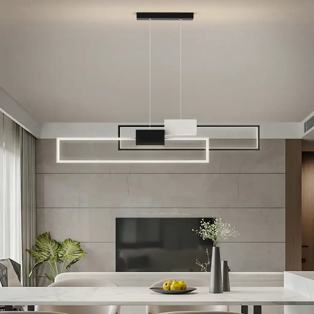 Sleek gold and white rectangular LED pendant light hanging over a modern kitchen island