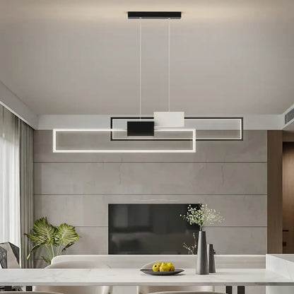 Sleek gold and white rectangular LED pendant light hanging over a modern kitchen island