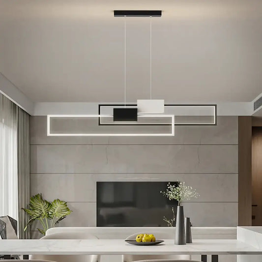 Sleek gold and white rectangular LED pendant light hanging over a modern kitchen island