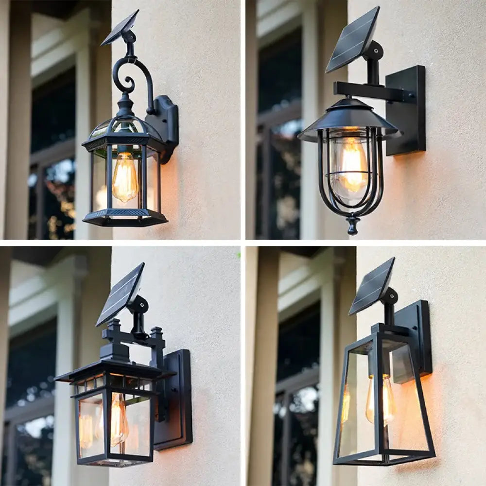 Black aluminum Sophia solar outdoor wall light lantern with glass panels on a front porch
