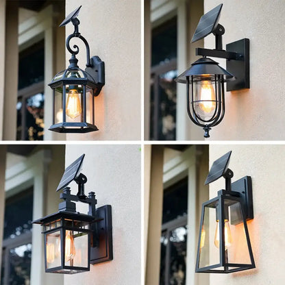 Black aluminum Sophia solar outdoor wall light lantern with glass panels on a front porch