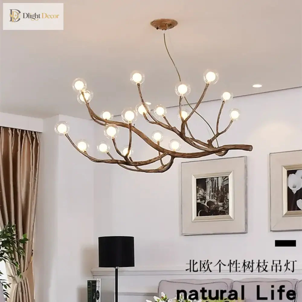 Sylvie branch LED wall sconce with clear glass ball lights in a modern hallway