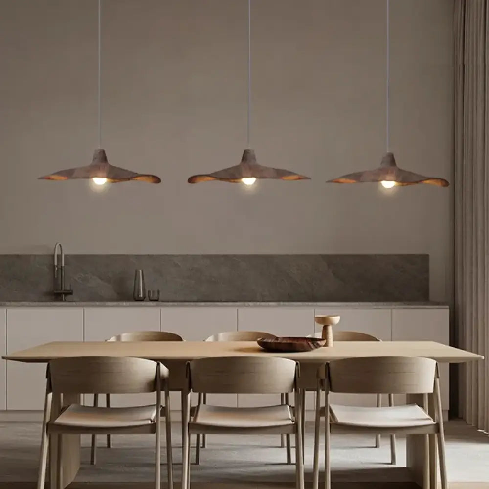 Vintage Wabi-Sabi pendant light with an organic textured shade above a dining table