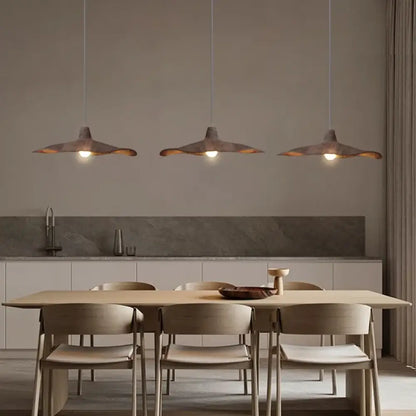 Vintage Wabi-Sabi pendant light with an organic textured shade above a dining table
