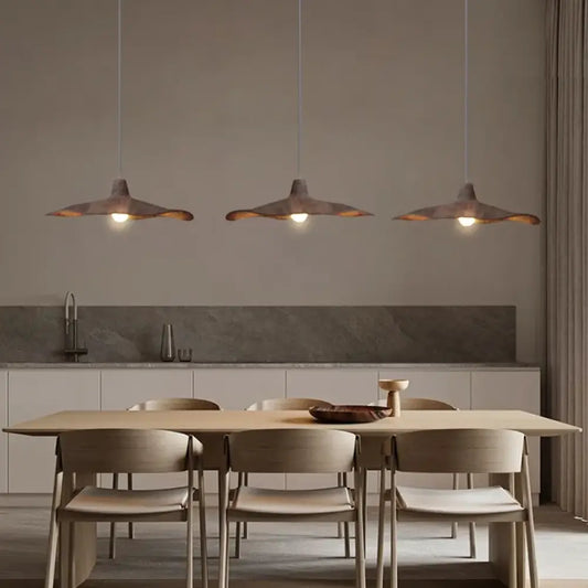Vintage Wabi-Sabi pendant light with an organic textured shade above a dining table