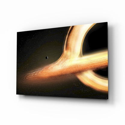 Golden black hole with glowing accretion disk glass wall art in a home office