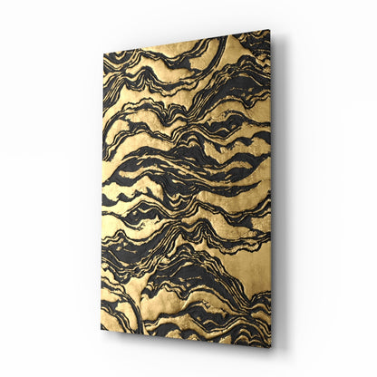 Black and gold marbled ripple waves glass wall art hanging in a glam dining room
