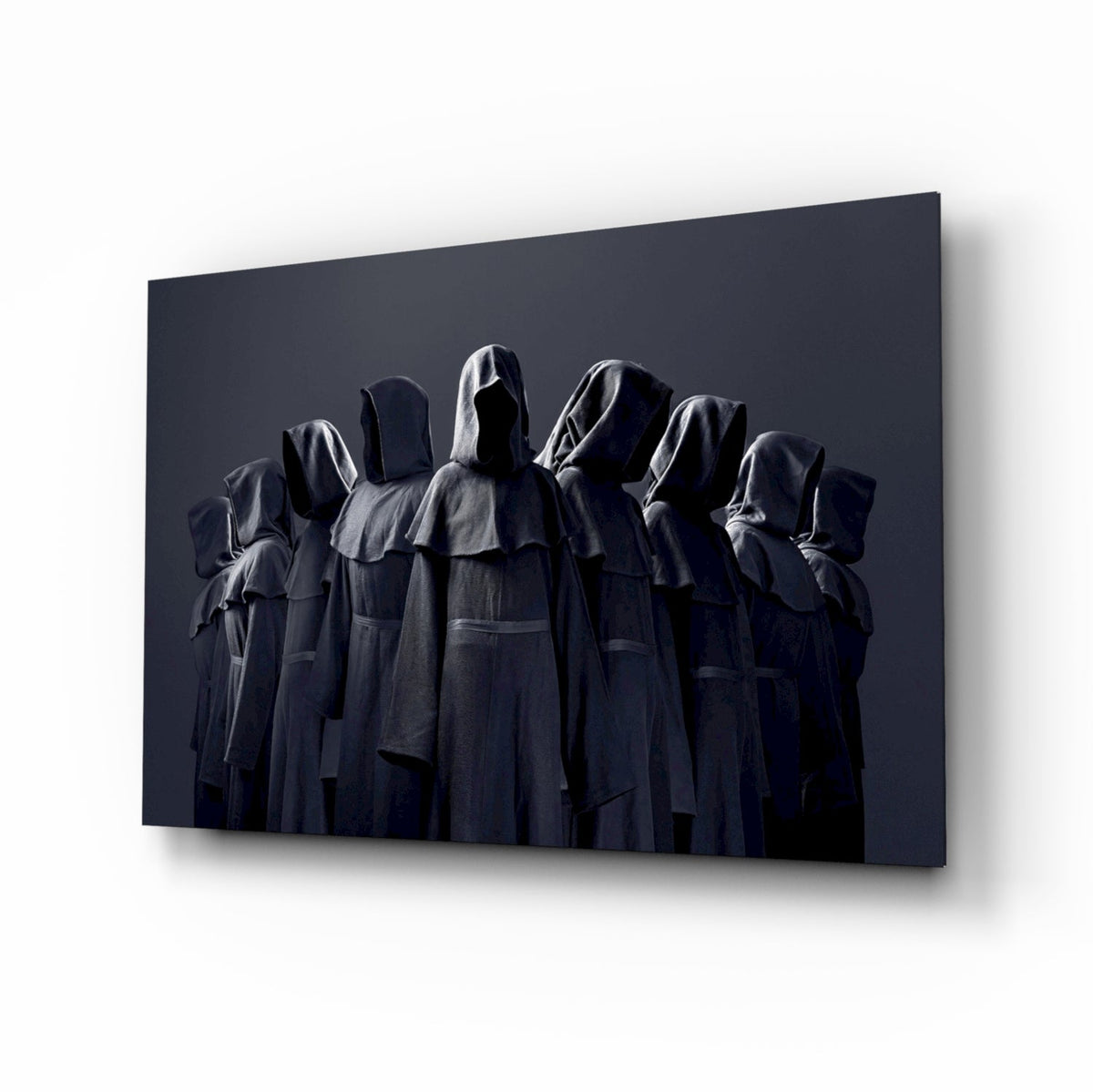 Nine hooded faceless figures in charcoal robes glass wall art in a basement bar