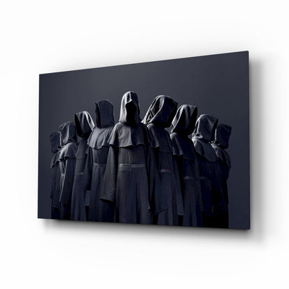Nine hooded faceless figures in charcoal robes glass wall art in a basement bar