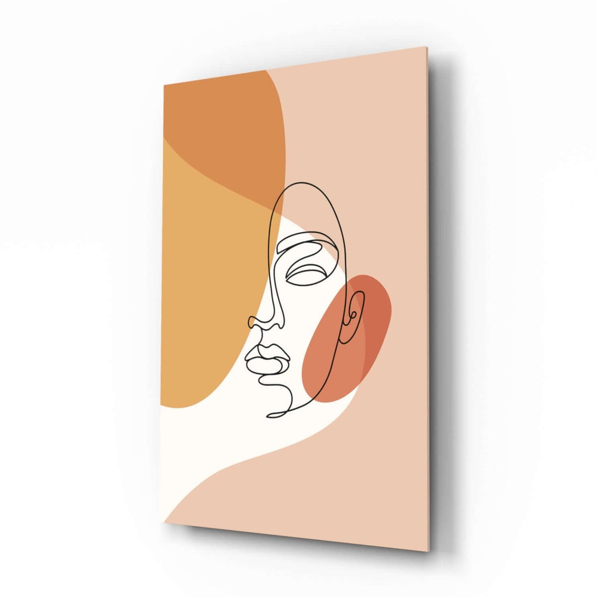 Boho line drawing woman face glass wall art with peach and marigold shapes in a calm bedroom